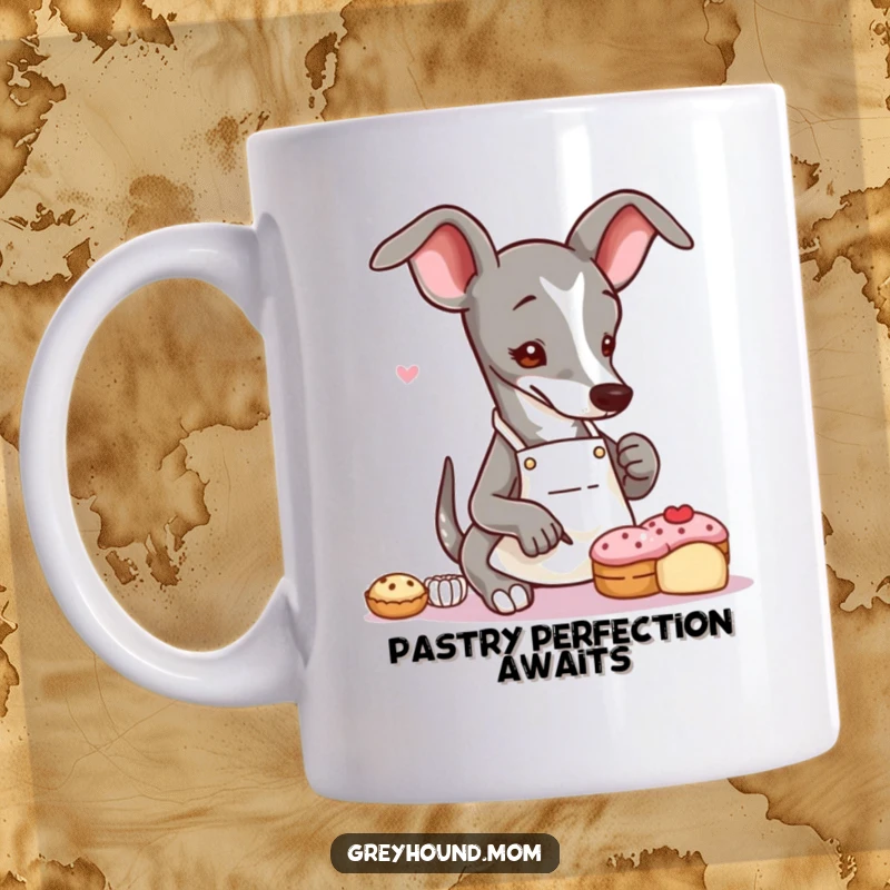 Funny Greyhound baker mug showing a slender dog in a small apron, delicately decorating a tiny pastry with artistic flair.