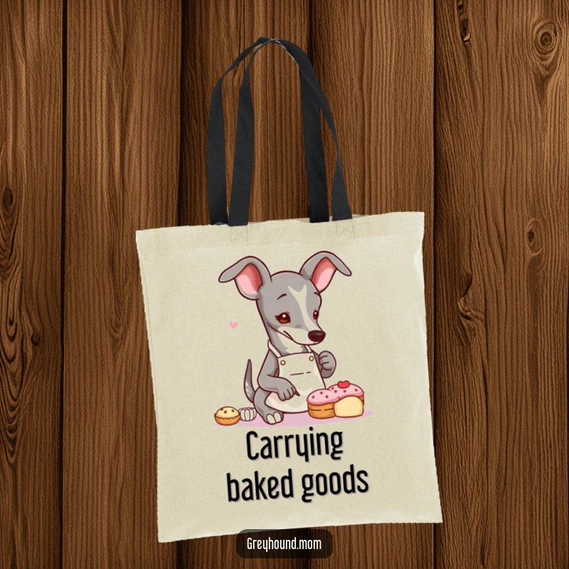 Funny Greyhound baker tote bag with a slender dog in an apron, delicately decorating a tiny pastry, perfect for everyday use.